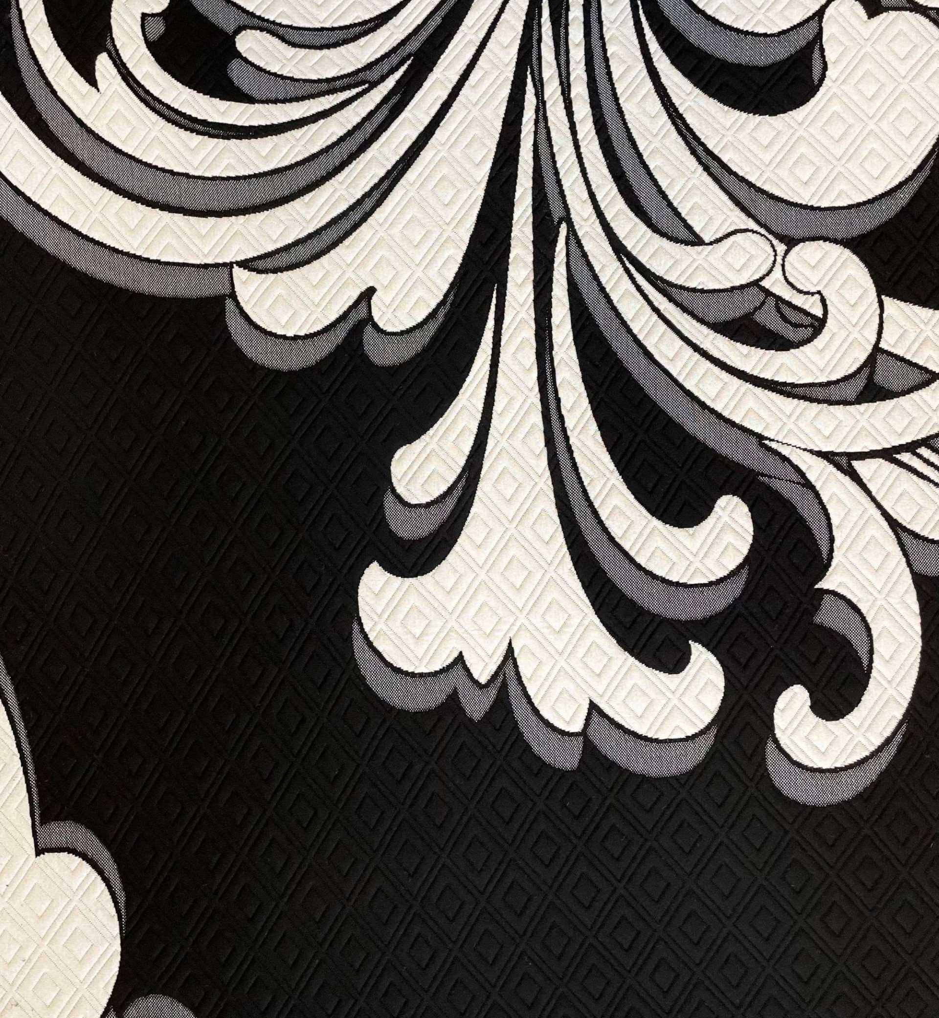 Black and white mattress fabric with bold baroque pattern.